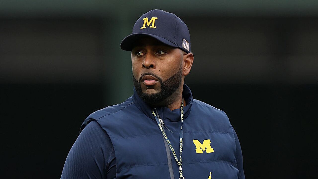 The Wolverines' football coach was fired on Wednesday and was later detained by police.