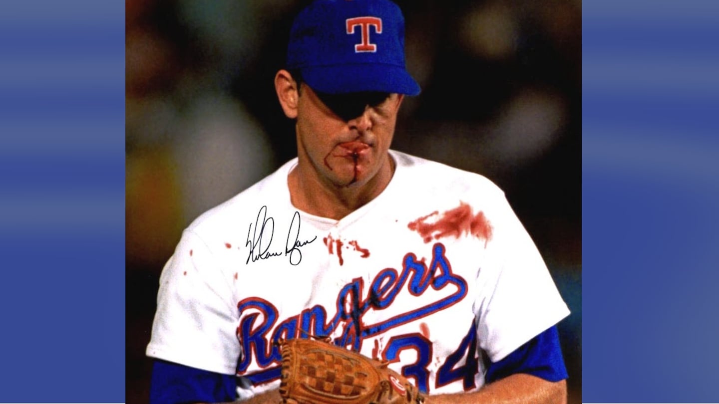 Nolan Ryan prepares to pitch while sporting a bloody jersey.